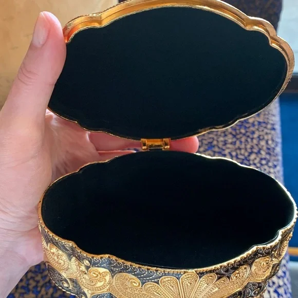 Absolutely stunning jewelry box , golden and black top, made in UAE. Must have!